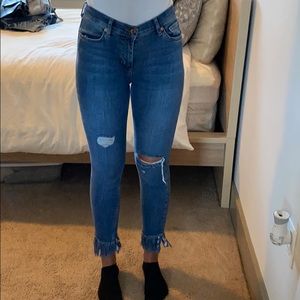 FREE PEOPLE fringed bottom jeans